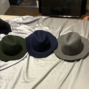 Trio of Stylish Hats in Green, Blue, and Gray